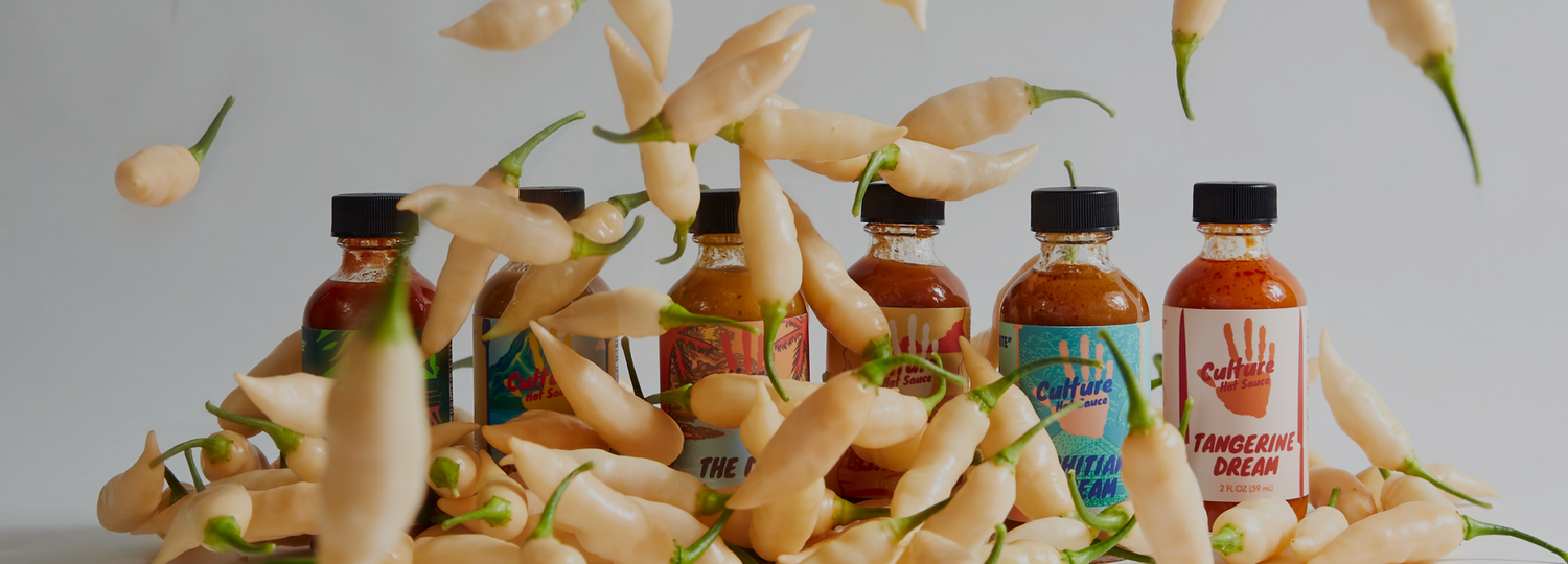 chilli falling on small sauce bottles. gift sample pack, birthday husband boyfriend fathers day gift. give the best gift pack as a present to your loved one. A collection of our best selling and favorite sauces for your maximum enjoyment.