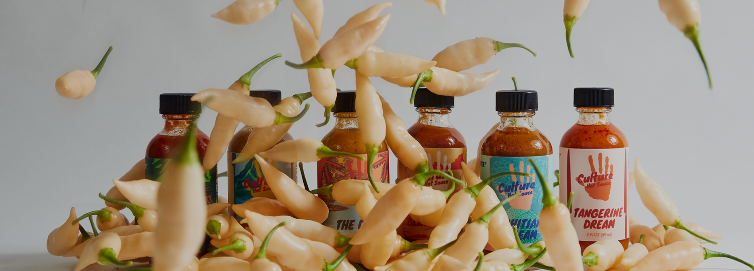 chilli falling on small sauce bottles