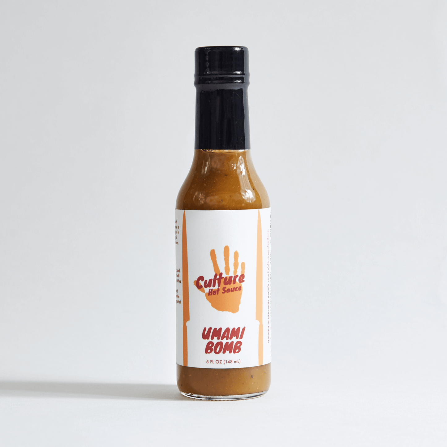 Umami Bomb Culture Hot Sauce bottle – a Japanese-style hot sauce with an Italian flair, featuring pickled black garlic, colatura di Alici, ponzu, and a premium dashi blend. Bursting with natural umami richness, deep, lingering flavor with no added MSG.
Great on: Poke, steak, fried rice, ramen, Hawaiian dishes, chicken, dumplings, hot pot.
Ingredients: Onion, rice vinegar, chili pepper medley, tamari (gluten-free), water, yuzu, fish sauce, sun-dried tomato, porcini, sea salt, dried cayenne, pickled garlic