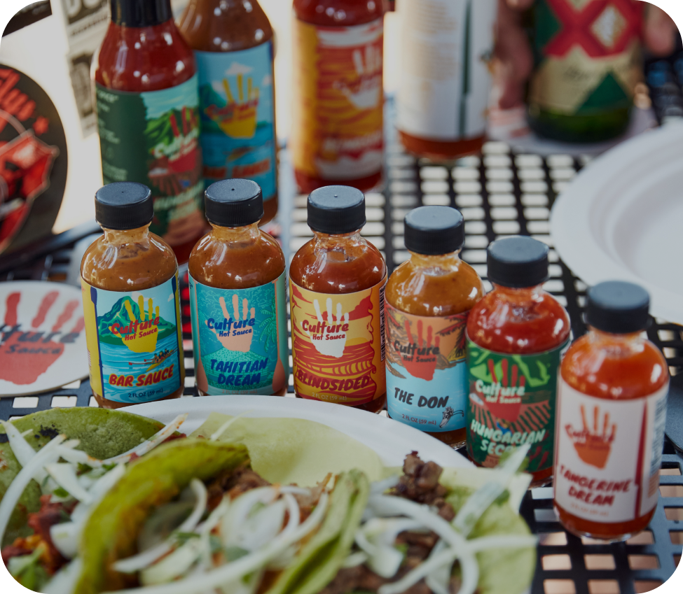 sauce bottle line up with tacos
