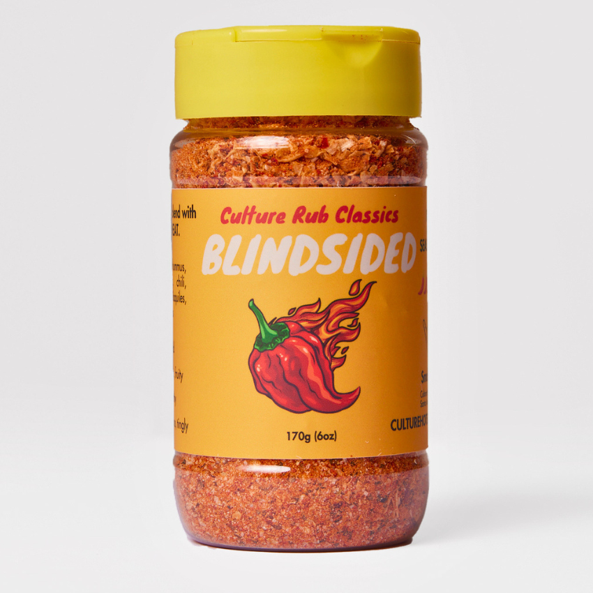 Blindsided rub seasoning– a bold, supremely spicy, and smoky blend inspired by our hottest and most popular sauce. Featuring Carolina Reaper heat with sweet Hungarian paprika, chipotle, cumin, and Szechuan peppercorn, this salt-free mix delivers a hot, vibrant flavor with a lingering smoky kick. Perfect for BBQ, hummus, mac 'n' cheese, eggs, chili, steak, corn, ribs, chilaquiles, pork chops, dips, and tacos. Family farm sourced, fresh ground, with no preservatives or additives—pure fire in every bite! spice