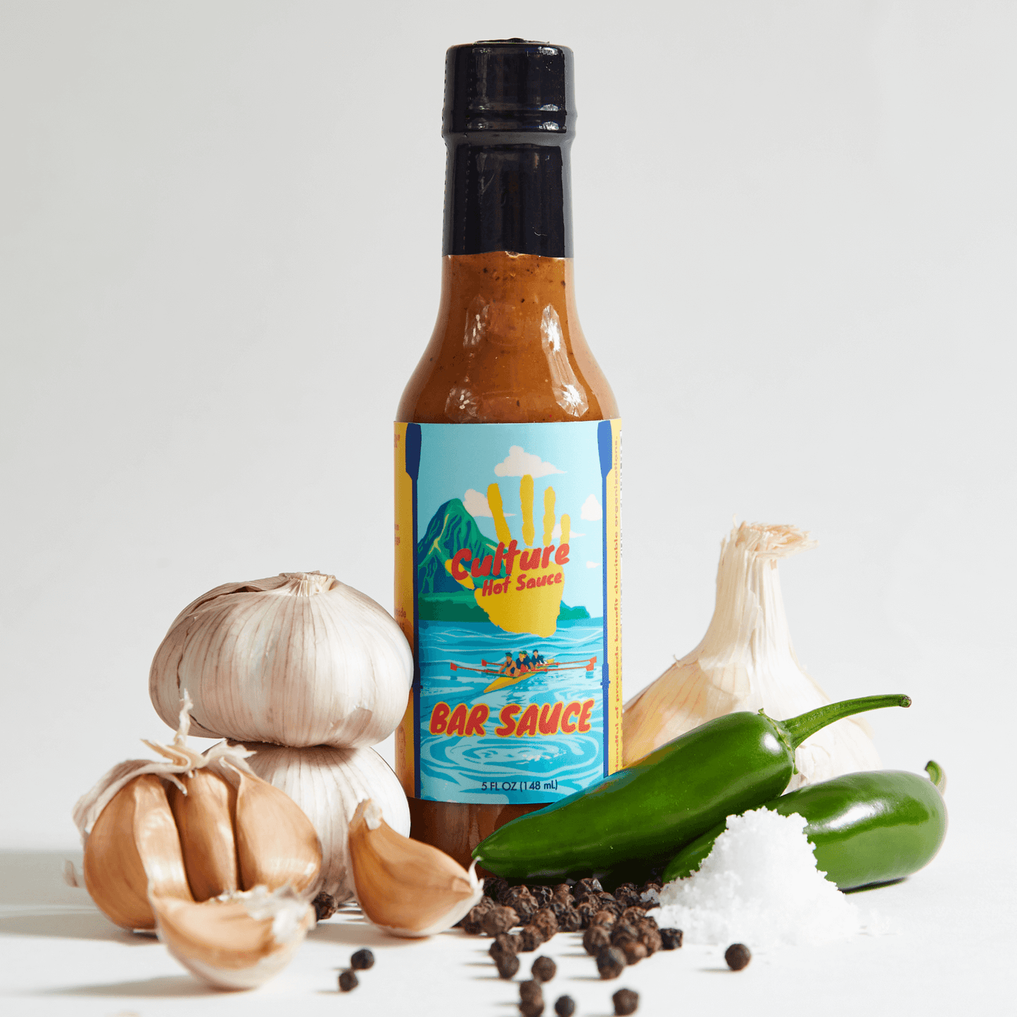 Bar sauce, best seller, garlic jalapeños salt and pepper, good on everything, most flavorful, culture hot sauce bottle, front image rowing in Hawaii