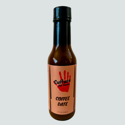 Experience the bold fusion of fresh roasted coffee and sun-dried desert dates in our artisan Coffee & Dates Hot Sauce. Made with locally sourced California chilis, this sauce delivers rich, deep flavors reminiscent of enchilada and mole sauces. 
 Perfect for elevating your favorite café staples like bagels, breakfast burritos, and savory pastries—or adding complex depth to a perfectly cooked steak.
Great on: Bagels, breakfast dishes, eggs, steak, avocado toast.
Ingredients: Vinegar, coffee, chilies, dates,