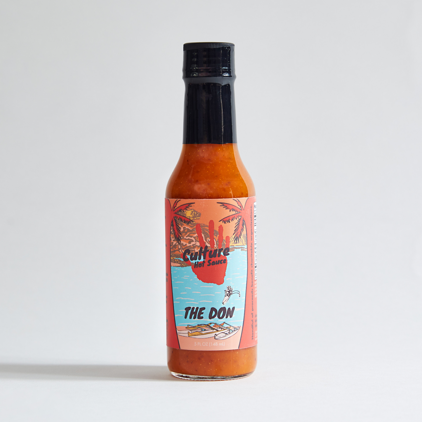The Don Hot Sauce – Culture Hot Sauce’s original classic! A bold blend of pineapple, habanero, and mustard seed, delivering a bright, exciting flavor with a slow-burning heat. Bottle surrounded by fresh ingredients, showcasing its tropical, tangy, and fiery essence.