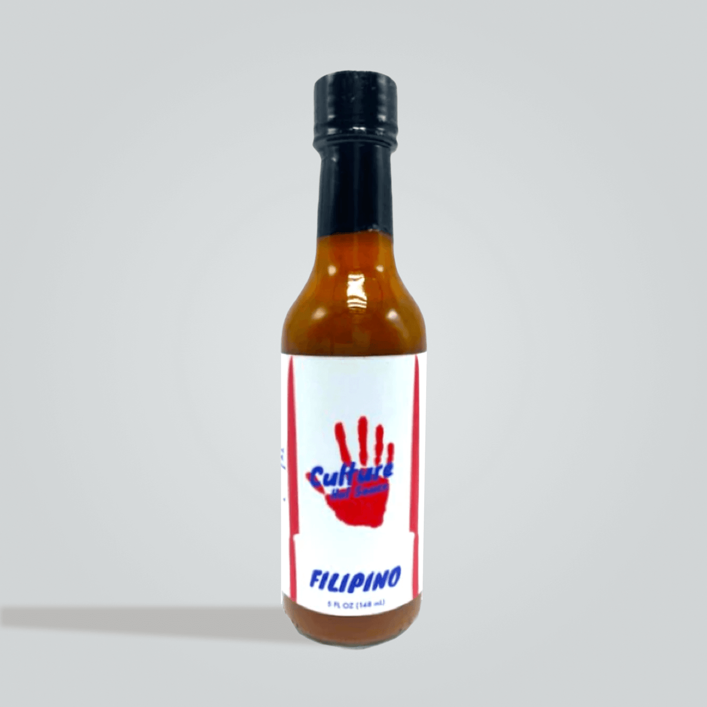 filipino hot sauce bottle, adobo, bay leaf, black pepper, onion, garlic, cane vinegar, soy sauce