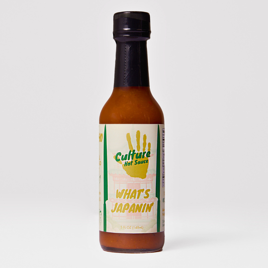 Culture Hot Sauce’s What’s Japanin’? – A Japanese citrus-based hot sauce crafted for fish, sushi, and izakaya. Featuring a tangy blend of yuzu kosho, sudachi, persimmon vinegar, and Hawaiian sweet honey, this sauce delivers a bright, fresh burst of heat with layers of umami.

Perfect for: Sushi, nigiri, sushi rolls, green pozole, soups, izakaya dishes, wagyu, and fish.

Ingredients: Onion, Golden Cayenne, Rice Vinegar, Water, Persimmon Vinegar, White Honey, Sea Salt, Sudachi, Yuzu Kosho, Sansho Pepper.